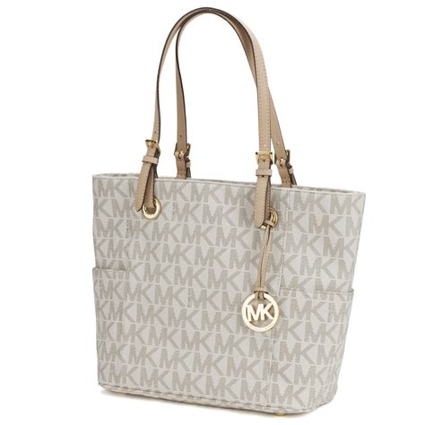 michael kors jet set travel large ew vanilla tote|Michael Kors bag with airplanes.